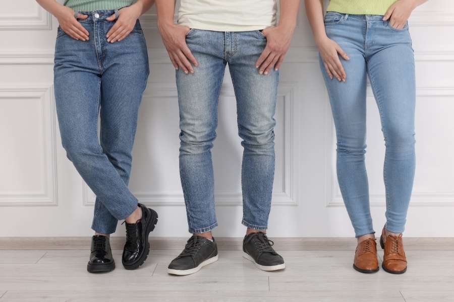 A group of people wearing different styles of denim, showcasing how to choose the Right Jeans.